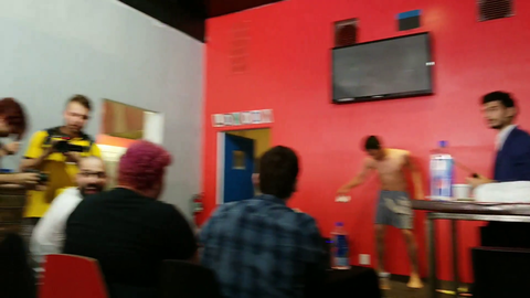 Performer eats then vomits a live fish, then does it again.