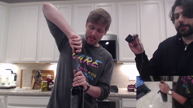 Chance trying to remove a cork from the wine