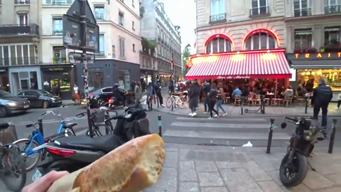 Immediately after taking a bite out of his baguette, Jake gets asked for directions in French