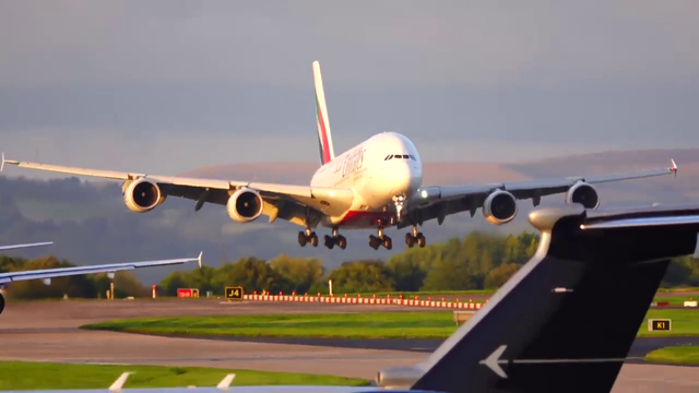 Beautiful sight of a gigantic Emirates Airbus A380 landing in the golden hour at Manchester