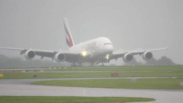 Landing Emirates Airbus A380 produces huge water spray on touchdown in Manchester