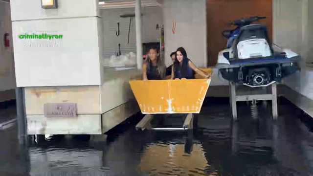 Arther's handmade wooden boat floats in the water