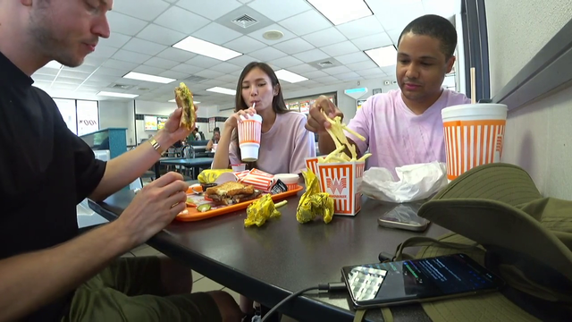Nick eating a box of fries in 30s
