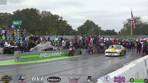 Drag racer wheelies and hood flies off