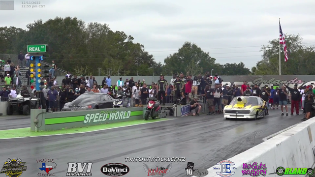 Drag racer wheelies and hood flies off