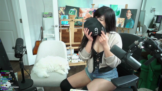 Quqco smells Lacari's Hat