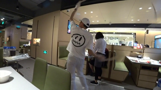 asian dude dancing with his noodle in front of Jake