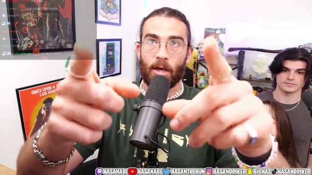 Hasan show's how high he puts his desk while standing up
