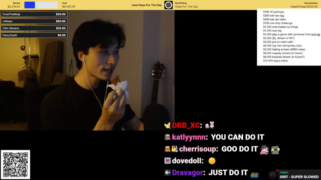 Liam eats a hot chip.