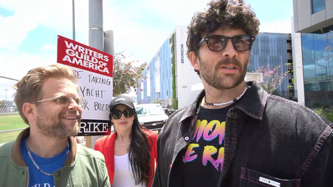 Hasan on the front lines picketing with Writers Guild of America