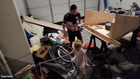 Erobb tripped by his kid, who then laughs at him being covered in his spilled drink