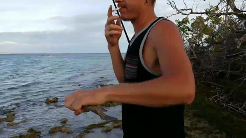 Alec Ludford bitten by fish during his "Always kiss the fish"