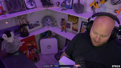 Tim opens a gift from the Doc...