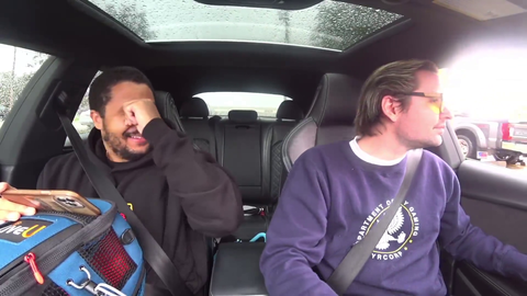 two normal people being normal in a drive through
