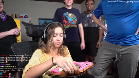 maya takes a bite out of a cookie and enjoys it
