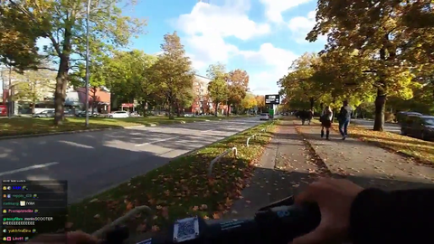 Jinny obstructs two bikers and runs red light while on scooter