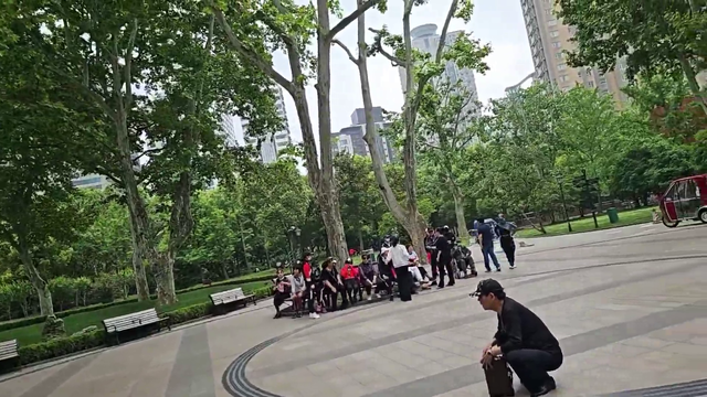 Jake practices ABC's with a Chinese grandmother in Shanghai, China
