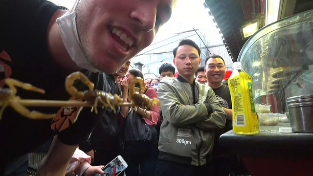 Eating scorpions.
