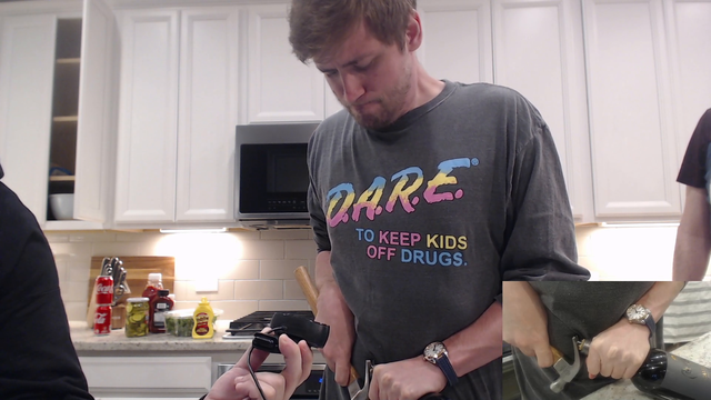 Sodapoppin pops open the wine bottle