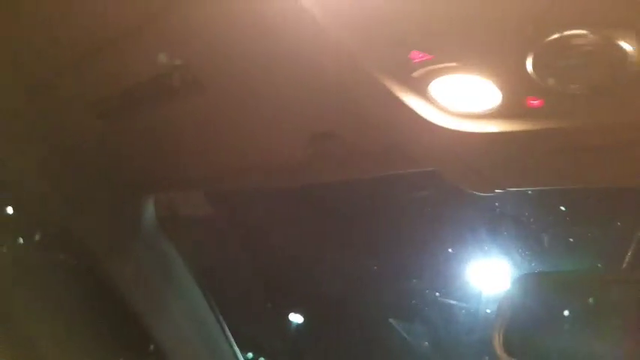 Greek having trouble getting out of a car