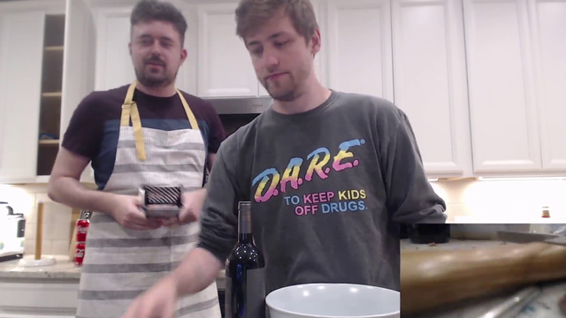 Soda and Rob filters wine through a cheese grater