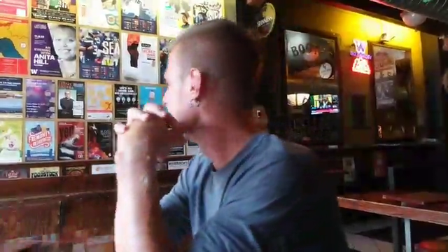 AlecLudford shows the bartender his fake ID