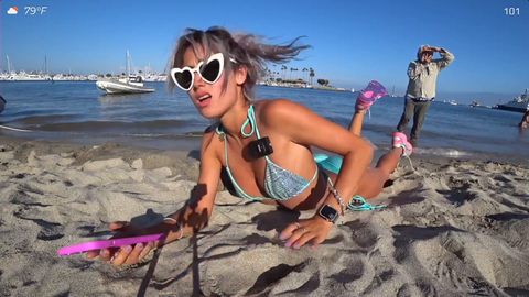 Man tries to act natural after secretly creep recording on beach