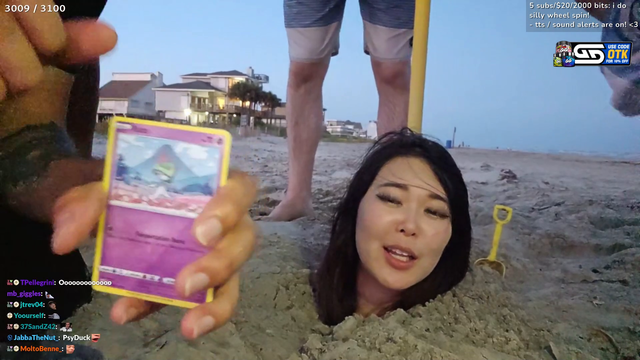 ExtraEmily opens a pokemon booster pack while buried alive.