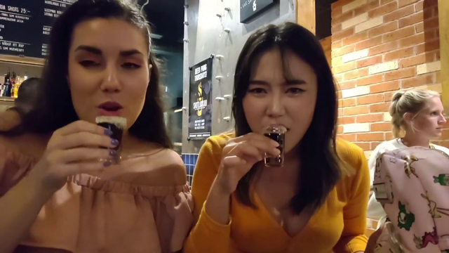 Yuggie chugs a liquorice shot two times