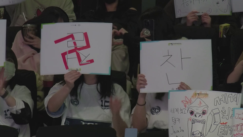 Girl Holds interesting sign at overwatch event