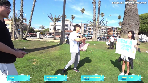 A homeless man misses water balloon throw and wakes someone up!
