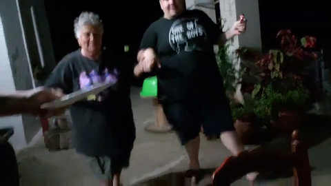Andy smashes plates while greek dances with an elderly woman