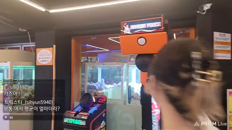 Girl attempts punching machine.