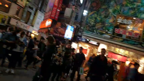 Andy Milonakis gathers a crowd rapping in Japan