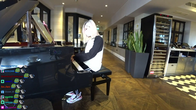 Hachu plays piano in a tea room