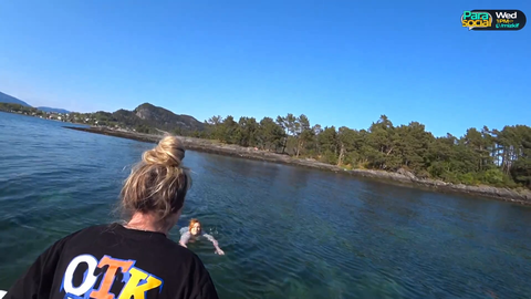 Britt and Melena go swimming in a Norwegian Fjord.