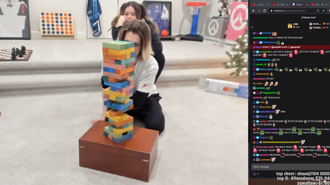 Single mother plays Jenga with her special needs child
