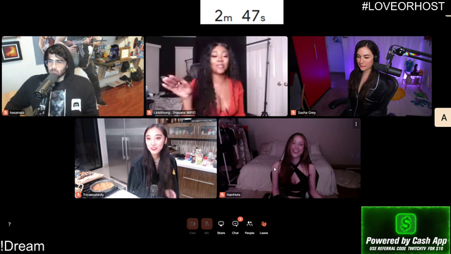 Sasha Grey reaches over to give an 18+ product to another guest