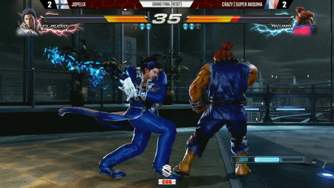 Tekken player throws a controller at someones face after winning.