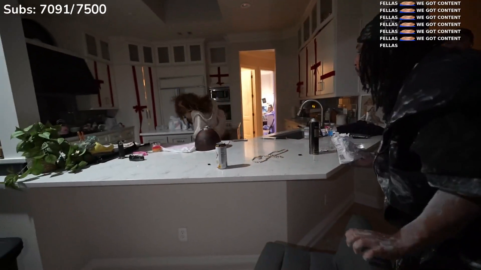 Cinna and Agent have a flour fight and get flour everywhere in her house