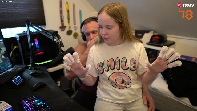 Knut shows his daughter his covid test result.