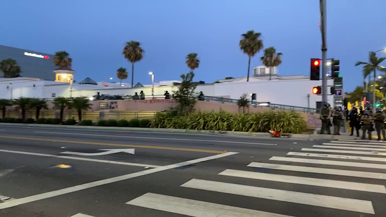 LAPD shoots rubber bullets at protesters and throws tear gas into the crowd
