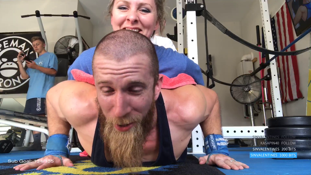Man tries to do pushups with wife and son on his back!!!