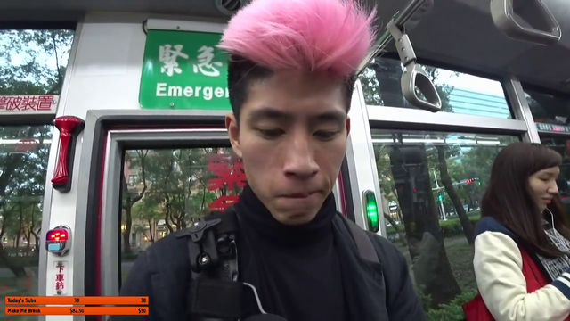 Girl on bus snap a pic of Joey on the sly (probably laughing at his pink skunk hair)