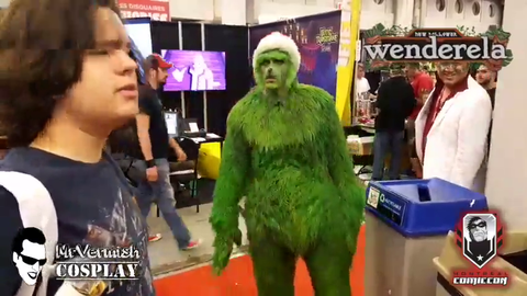 Kid shares food with hungry grinch