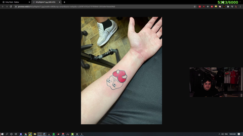Juicer shows a tattoo to poke
