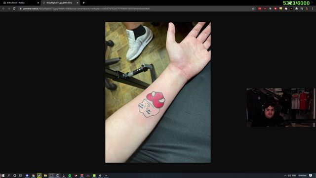 Juicer shows a tattoo to poke