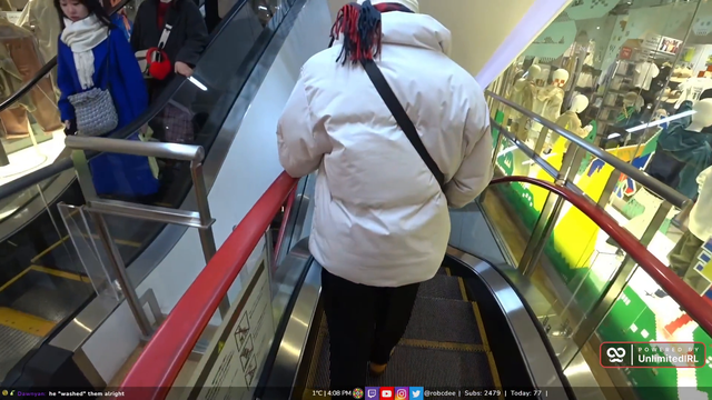 The Angle pushes someone off the escalator