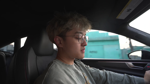 Jason looking at phone while driving