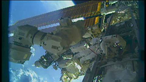 Drew Feustel climbing the ladder